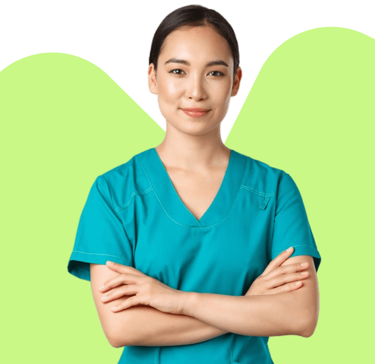Healthcare clinician in teal scrubs standing with arms folded