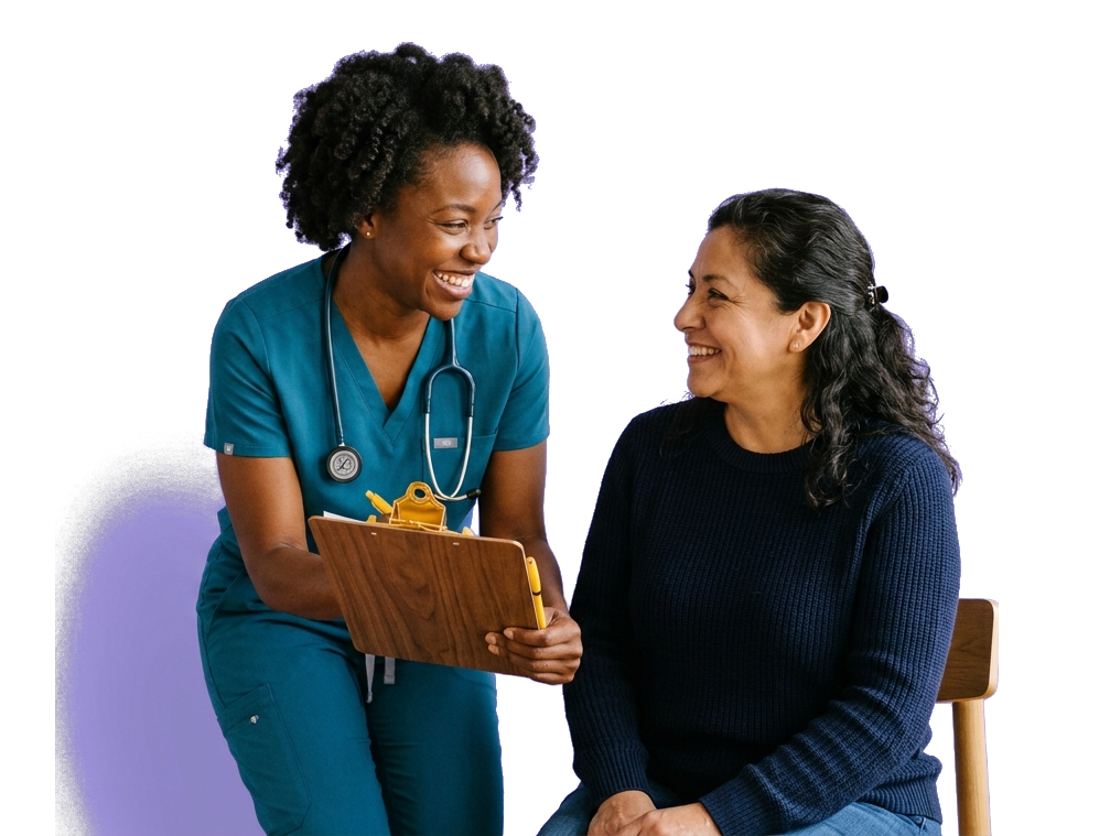 A nurse practitioner in teal scrubs holding a clipboard and smiling with a seated patient during an outpatient visit.